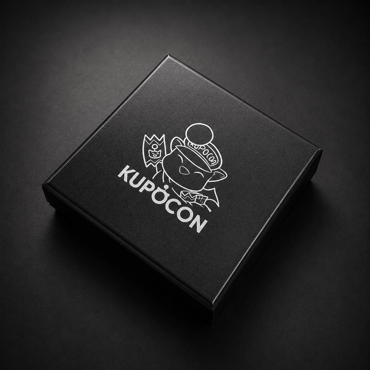 KupoCon 10 Year Anniversary commemorative silver-plated coin in a wooden display box with numbered collector's card